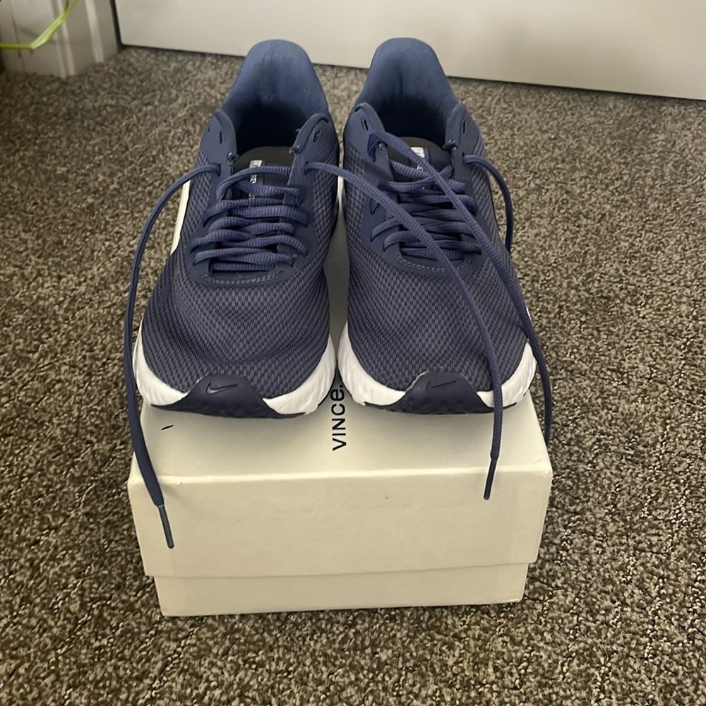 Nike Revolution sneakers, size 9 1/2, good condition.